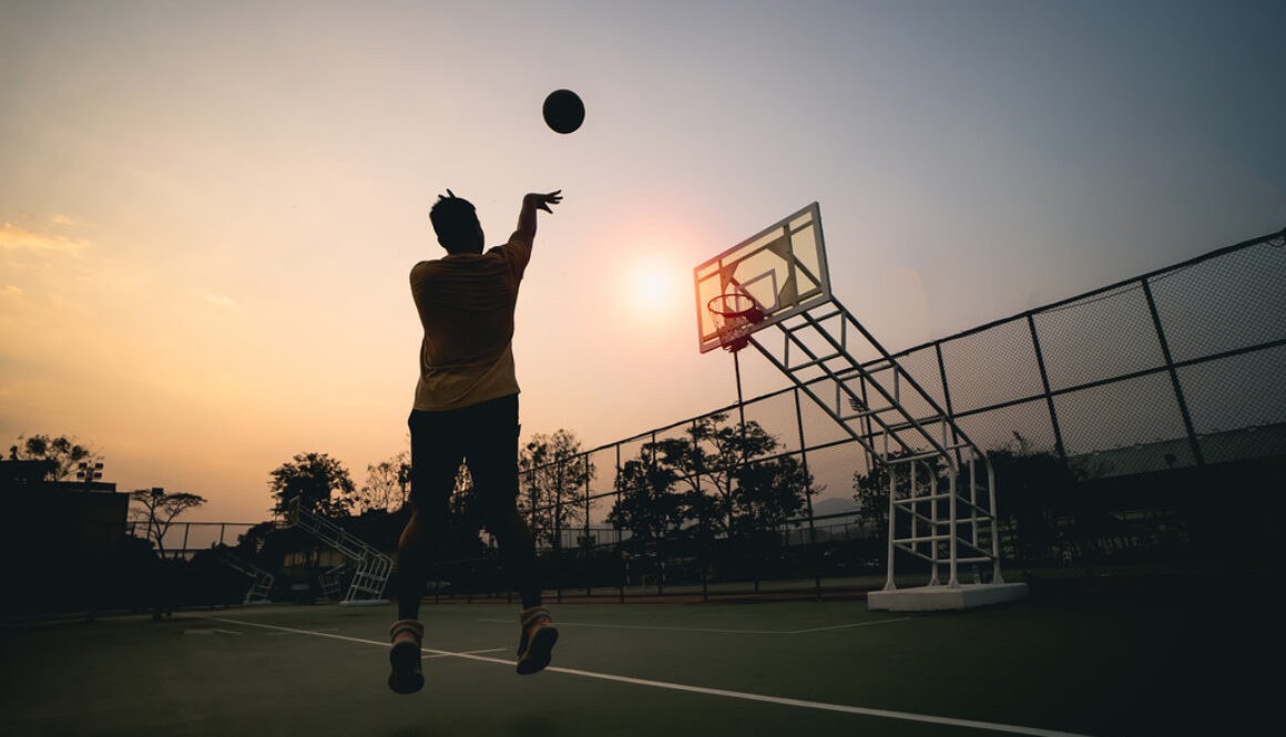 Basketball Player Shoots Hoops at Sunset at Risk of Needing Arthroscopic Surgery