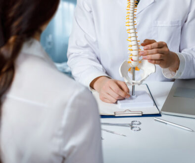 Doctor Talking to Patient About Minimally Invasive Spine Surgery