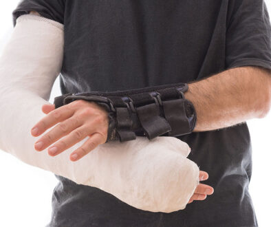 Closeup of a Man Wearing a Splint on One Hand and a Full Arm Cast on the Other Hand Splint vs Cast