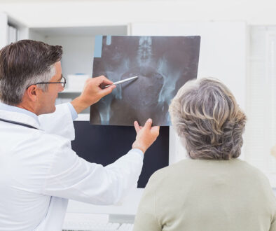 An Orthopedic Doctor Explaining a Hip X-Ray to a Senior Woman Patient Independent Orthopedic Practices